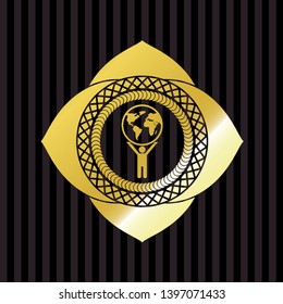 man lifting world icon inside gold badge
