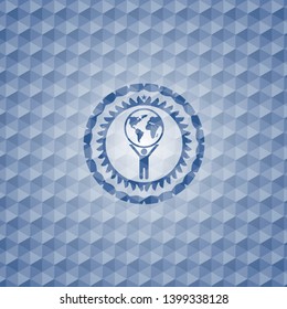 man lifting world icon inside blue hexagon emblem.