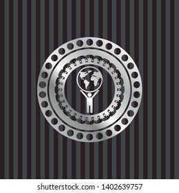 man lifting world icon inside silver badge
