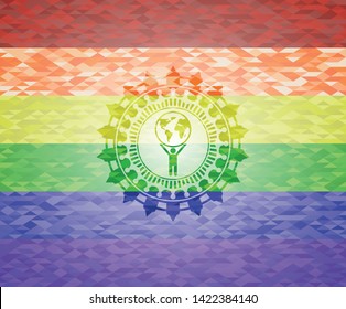 man lifting world icon inside emblem on mosaic background with the colors of the LGBT flag