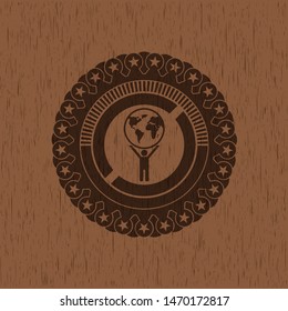man lifting world icon inside retro style wooden emblem