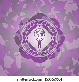 man lifting world icon inside pink camouflage emblem