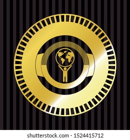 man lifting world icon inside gold shiny emblem