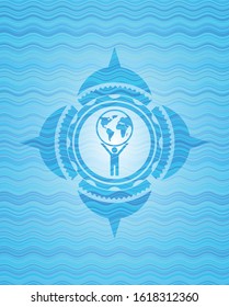 man lifting world icon inside water emblem background.