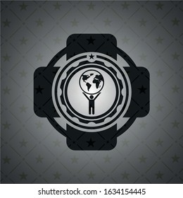 man lifting world icon inside black badge