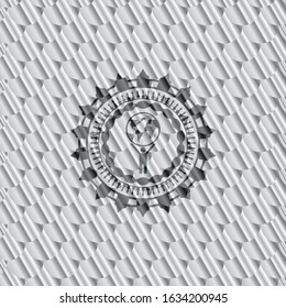 man lifting world icon inside silver shiny emblem. Scales pattern. Vector Illustration. Detailed.