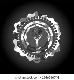 man lifting world icon on grey camo pattern