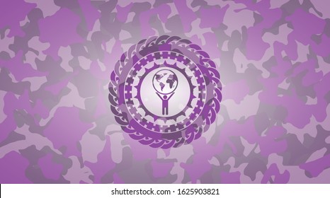 man lifting world icon on pink camouflaged pattern
