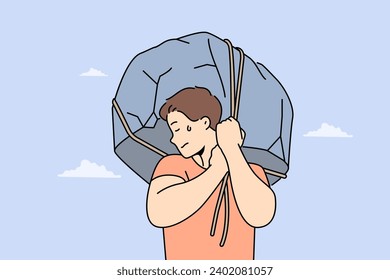 Man lifts huge stone demonstrating strength and readiness for difficult work to achieve success. Piece of rock in guy hands symbolizes difficult life circumstances that cause discomfort and suffering