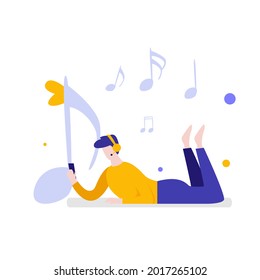 A man listening to music while lying down