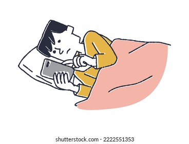 A man looking at his smartphone before going to bed
