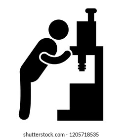 Man looking into machine depicting labor working 