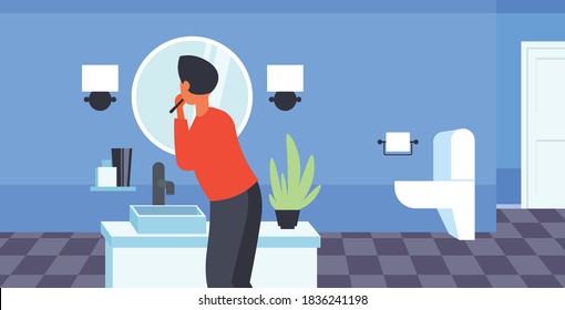 man looking to mirror brushing teeth with toothbrush health care dental hygiene concept modern bathroom interior rear view horizontal portrait vector illustration