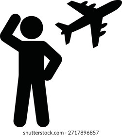Hombre que mira el avión que vuela en el cielo