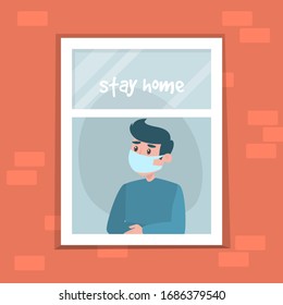 Man looking at the window. Stay home, stay healthy, coronavirus pandemia in 2020. Male person wearing mask in quarantine. Facade of the brick house.