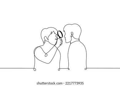 man looks at man through magnifying glass - one line drawing vector. concept a man studies another, alien too strange person