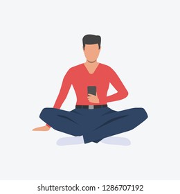 Man in lotus position with smartphone. Guy, sport, good shape. Can be used for topics like fitness, active lifestyle, health