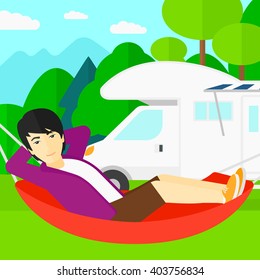 Man lying in hammock.