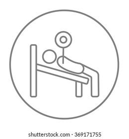 Man lying on bench and lifting barbell line icon.