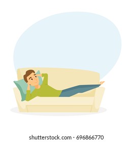 Man lying on the sofa. Happy smile guy relaxing and dream on couch. Person resting. Home leisure