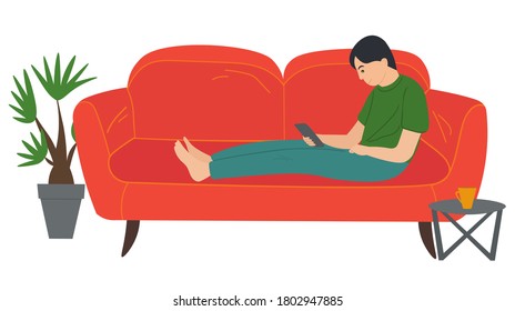 A man lying on the sofa, holding a smartphone. Relaxing at home concept vector flat design. Cheerful man is sitting on couch and is holding phone in hand. Rest time, leisure, free time after work