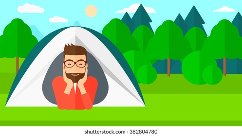 Man lying in tent.