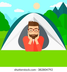 Man lying in tent.