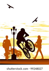 Man makes a jump on a bicycle in the middle of the day