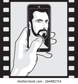 Man Makes Selfie with Smartphone in Hand