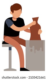 Man making pottery. Guy working with raw clay