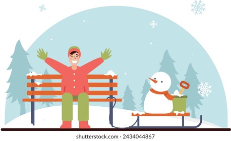 Man making a snowman in park