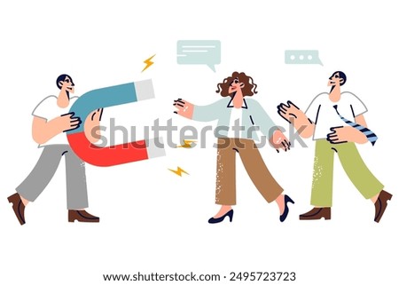 Man marketer attracts and retains clients or service buyers using magnet to increase sales. Guy from company recruiting department holds magnet while building business team of qualified employees