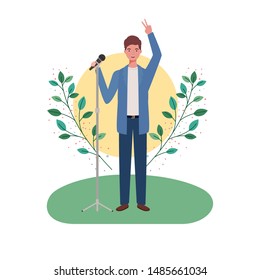 man with microphone and branches and leaves in the background