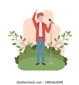 man with microphone and branches and leaves in the background