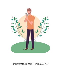 man with microphone and branches and leaves in the background