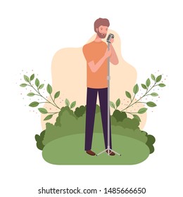 man with microphone and branches and leaves in the background