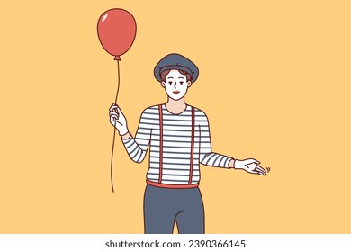 Man mime with balloon invites you to comedy theater performance with paraders and clowns. Mime circus actor guy with white face dressed in striped t-shirt and pants with suspenders