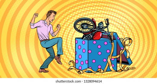 Man and motorcycle holiday gift box, funny reaction joy. Pop art retro vector illustration vintage kitsch 50s 60s