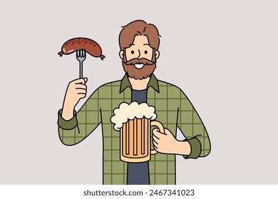 Man with mug of beer in hands and Bavarian sausage smiles, visiting pub or tavern to relax after working week. Happy guy participating in oktoberfest enjoying taste of foamy beer and meat snacks