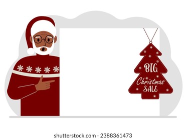 A man near a large white sheet of paper with a big sale label on it. New Year and Christmas sales.