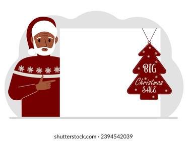 A man near a large white sheet of paper with a big sale label on it. New Year and Christmas sales.