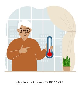 A man near the window with a device for measuring the temperature in the room.