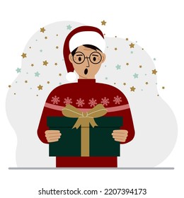 A man with a New Year's gift. Concept of preparing for Christmas, new year, receiving a gift, christmas sale or secret santa claus.