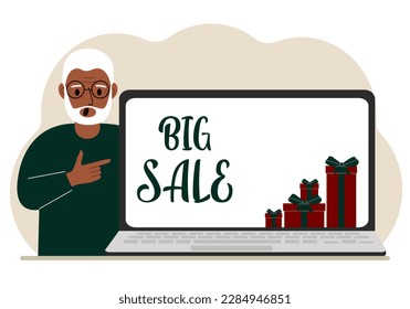 A man next to a large laptop, on his screen the text of big sales and a lot of gift boxes. Vector flat illustration