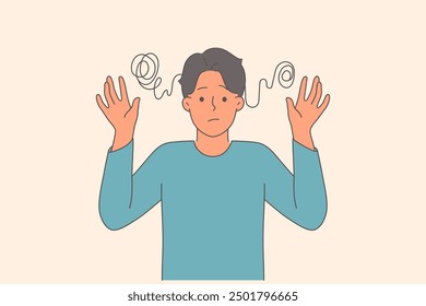 Man with obsessive compulsive disorder feels confused and raises hands in need of ocd treatment. Young guy with ocd does not understand what is happening due to psychological depression