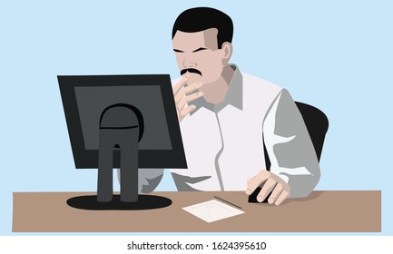 A man is an office employee, working at a computer.
