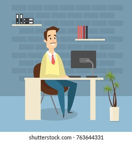 Man in the office sitting at the desk and working.