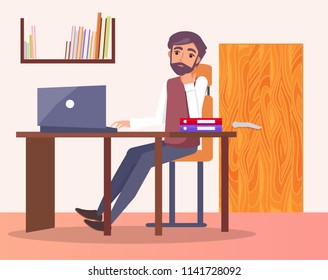 Man in office at workplace typing on computer, bookshelf and door behind him, male sitting at table on chair, entrepreneur worker, folders on desk
