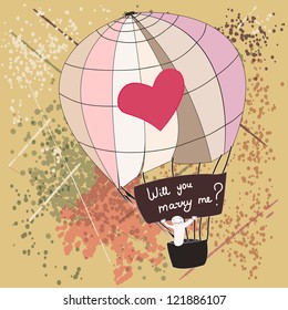 A man on a air balloon with a Ã?Â¨Marry meÃ?Â¨ poster