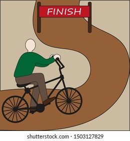 A man on a bicycle rides on the road to the finish